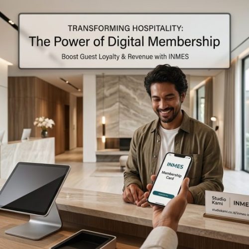 A wide-angle professional photograph of a modern hotel lobby, where a guest is actively using the INMES digital membership app on their smartphone at the front desk. A desk sign nearby explicitly displays the text 'studiokami.co.id/inmes-id/'.